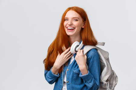 Education, student life and happiness concept. Cheerful good-looking redhead caucasian girl, college...