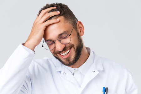 Healthcare workers, coronavirus, covid-19 pandemic and insurance concept. Headshot of handsome young...