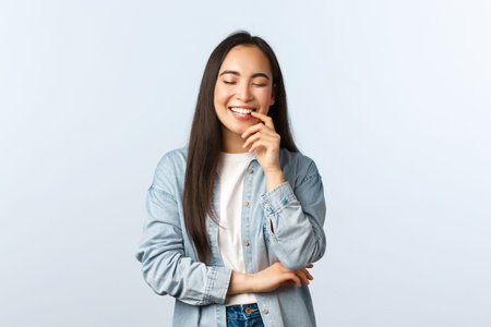 Lifestyle, people emotions and beauty concept. Carefree enthusiastic asian female with long dark...