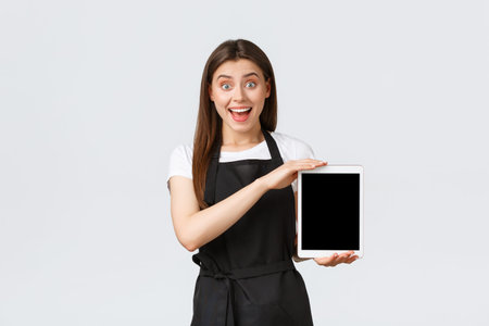 Grocery store employees, small business and coffee shops concept. Excited saleswoman showing cool...