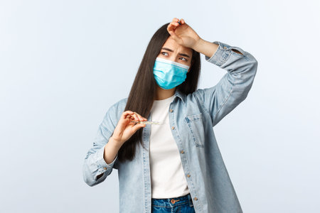 Social distancing lifestyle, covid-19 pandemic everyday life and leisure concept. Sick woman with...