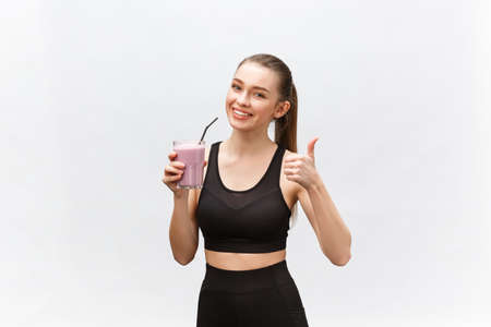 young happy woman with healthy diet shake drinking for sport and fitness.の写真素材