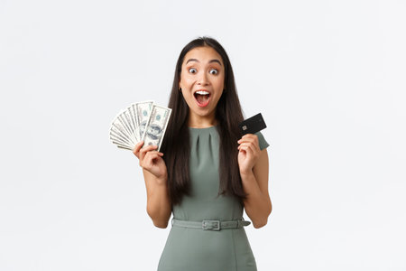 Small business owners, women entrepreneurs concept. Happy and surprised asian female got lots of...