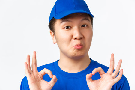 Online shopping, fast shipping, employees and home delivery concept. Close-up of impressed cute...