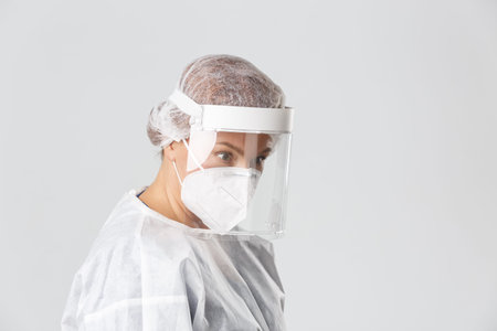 Medical workers, covid-19 pandemic, coronavirus concept. Profile of surprised female doctor in...