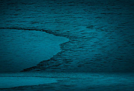 Vintage grunge blue concrete texture studio wall background with vignette.の写真素材