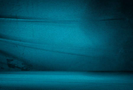 Vintage grunge blue concrete texture studio wall background with vignette.の写真素材