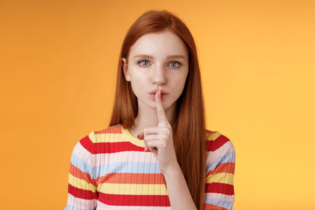 Girl hides lots secrets. Serious-looking redhead girlfriend blue eyes demand keep silent voice down...