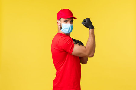 Express delivery during pandemic, covid-19, safe shipping, online shopping concept. Strong young...