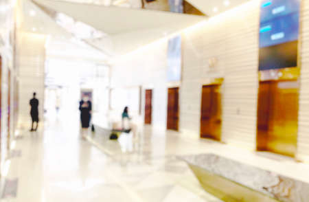Blur light background at shop in mall for business background, blurry abstract bokeh at interior hallwayの写真素材