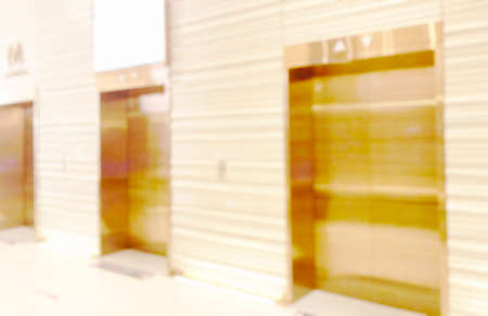 Blur light background at shop in mall for business background, blurry abstract bokeh at interior hallwayの写真素材