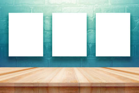 Poster or frame mock up template with office items and painting brushes on wooden tableの写真素材