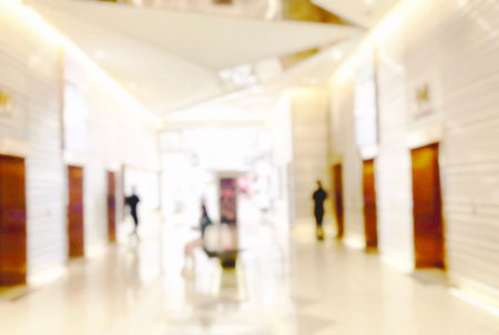 Blur light background at shop in mall for business background, blurry abstract bokeh at interior...