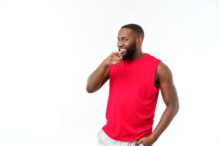 Young african american sport man pointing finger with surprised, feels successful and prosperousの写真素材