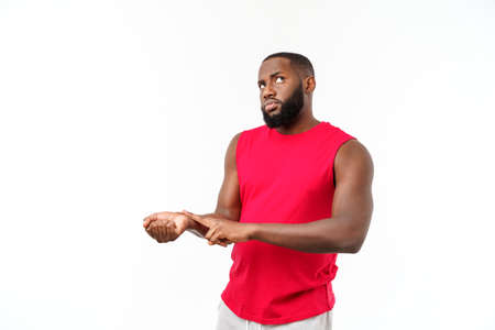 Man using touching on hand, checking heart rate after workout outdoors, copy spaceの写真素材