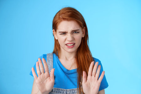Close-up uninterested displeased ignorant picky redhead girlfriend, frowning make disgusted grimace...
