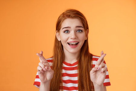 Excited hopeful redhead girl hope win lottery, smiling optimistic, look faith, believe dream come...