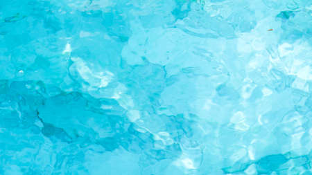 water swimming pool texture and surface water on pool, reflection blue wave nature water on the outdoor swimming poolの写真素材