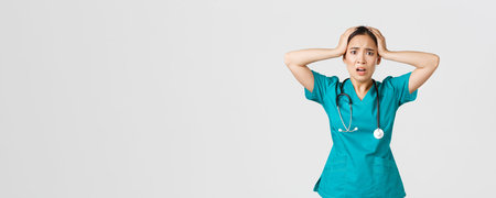 healthcare workers and preventing virus concept. Distressed and pressured asian female nurse, intern...