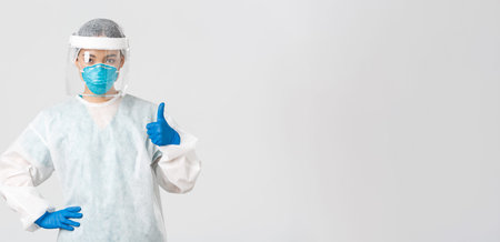 Covid-19, coronavirus disease, healthcare workers concept. Serious-looking professional female asian...