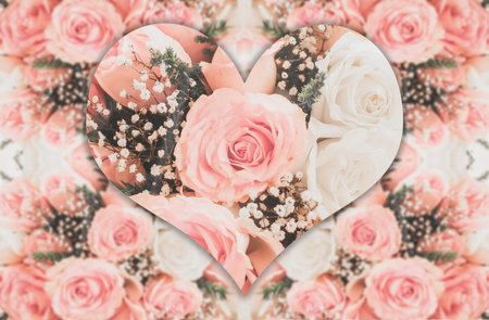 Pink roses with heart shape well use as a wedding or valentine backgroundの写真素材