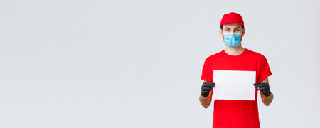 Covid-19, self-quarantine, online shopping and shipping concept. Express delivery guy during...