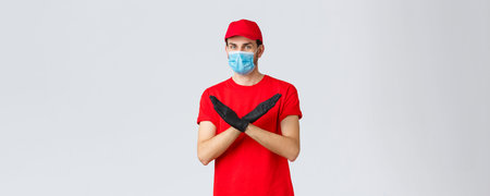 Covid-19, self-quarantine, online shopping and shipping concept. Courier disapprove contact during...