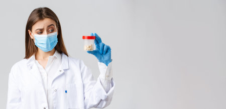 Covid-19, preventing virus, healthcare workers and quarantine concept. Unsure, curious doctor in...