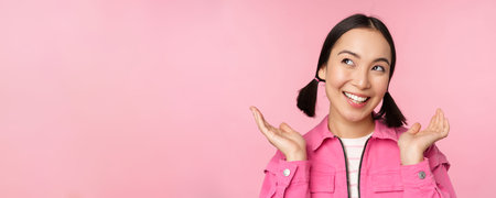Skin care and cosmetology concept. Beautiful asian girl smiling and laughing, showing clean healthy...