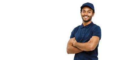 Delivery Concept - Handsome African American delivery man crossed arms over isolated on white studio Background. Copy Spaceの写真素材