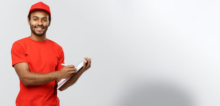 Delivery Concept - Portrait of Handsome African American delivery man or courier writing on a order...