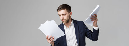 Business Concept - Portrait Handsome Business man serious working with annual report. isolated White Background. Copy space.の写真素材