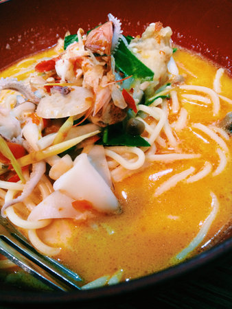 Instant Noodles Shrimp Tom Yum Flavor is the most popular Thai food, served in wooden bowl and place...