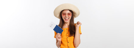 Portrait of happy tourist woman holding passport on holiday on white background.の写真素材