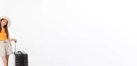 Full length of attractive young female in traveller casual with the travel bag, isolated on white backgroundの写真素材