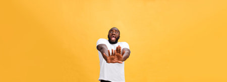 Portrait shock and annoyed displeased young man raising hands up to say no stop right there isolated...