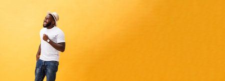 Full length young handsome african american man looking awayの写真素材