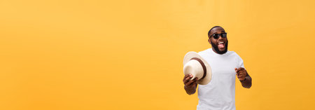 Young black man top dancing isolated on a yellow background.の写真素材
