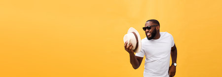 Young black man top dancing isolated on a yellow background.の写真素材