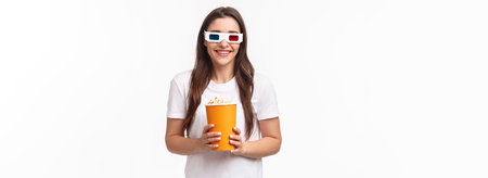 Entertainment, fun and holidays concept. Portrait of happy, joyful young girl enjoying watching...