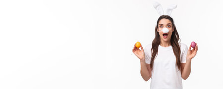 Easter party begins. Portrait of funny and cute, silly young caucasian woman celebrating divine day,...