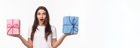 Celebration, holidays and presents concept. Portrait of surprised, excited beautiful young woman...