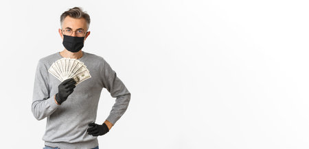 Concept of covid-19, social distancing and lifestyle. Portrait of successful middle-aged man in...
