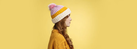 Profile shot attractive female curly hairstyle wearing hat knitted sweater standing queue order hot...