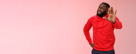 Hold on, stop right there. Portrait confused perplexed african american man cringing questioned...