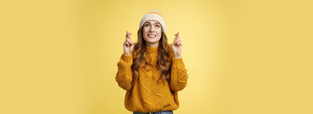 Nervous cute optimistic hopeful young attractive stylish woman praying god make wish look sky...