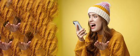 Annoyed pissed freak-out crazy woman shouting smartphone look display near face irritated arguing...