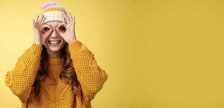 Surprised amused interested attractive young european woman wearing corduroy hat knitted sweater...