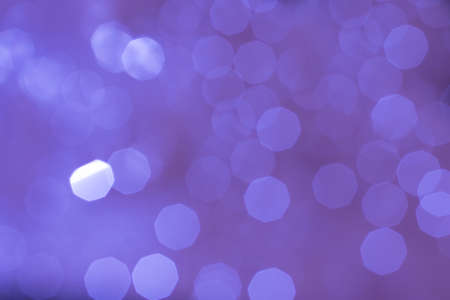 Abstract glittering purple bokeh background defocusedの写真素材