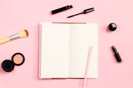 Beauty blogger objects flat lay. Beauty products and stylish female accessories on pastel pink backgroundの写真素材